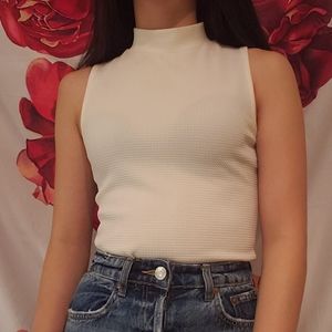 sleeveless mock neck top